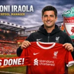 Andoni Iraola holding a Liverpool FC shirt at Anfield after being confirmed as the new Liverpool manager in 2026