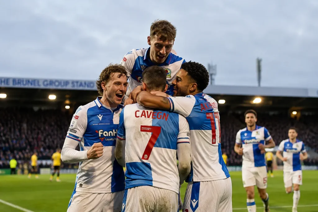 Bristol Rovers season lessons - Cavegn and Akhamrich celebrate a goal with teammates at the Memorial Stadium