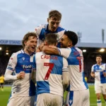 Bristol Rovers season lessons - Cavegn and Akhamrich celebrate a goal with teammates at the Memorial Stadium