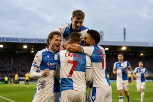 Bristol Rovers season lessons - Cavegn and Akhamrich celebrate a goal with teammates at the Memorial Stadium
