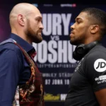 Fury vs Joshua Wembley face-off with Tyson Fury and Anthony Joshua staring each other down in front of the fight poster