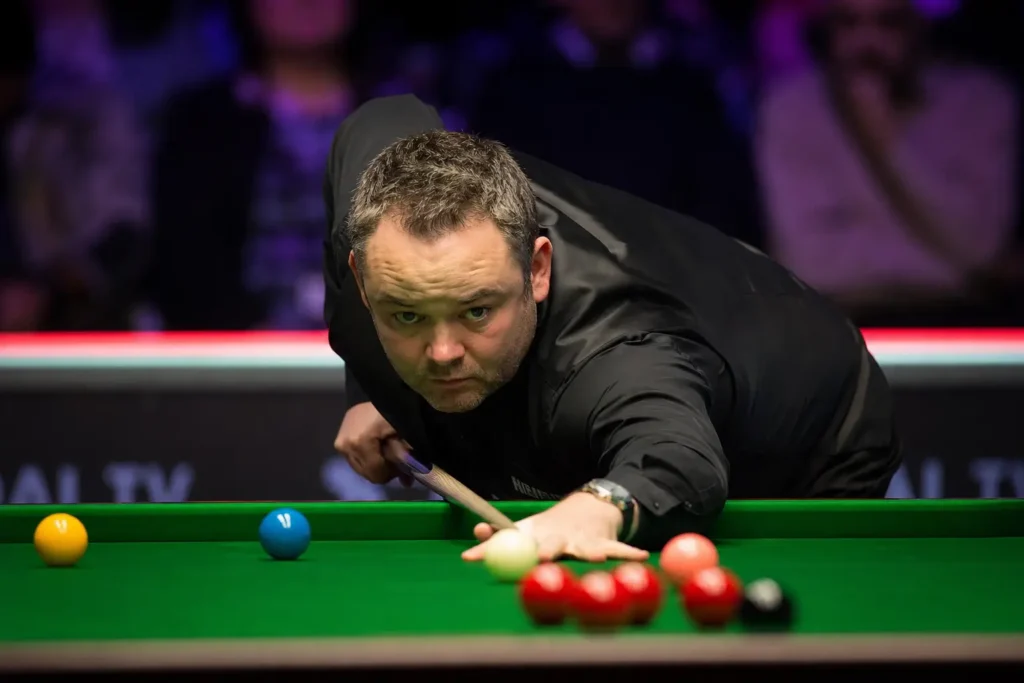 Stephen Maguire Championship League match with a professional snooker player lining up a shot during the tournament in Leicester.